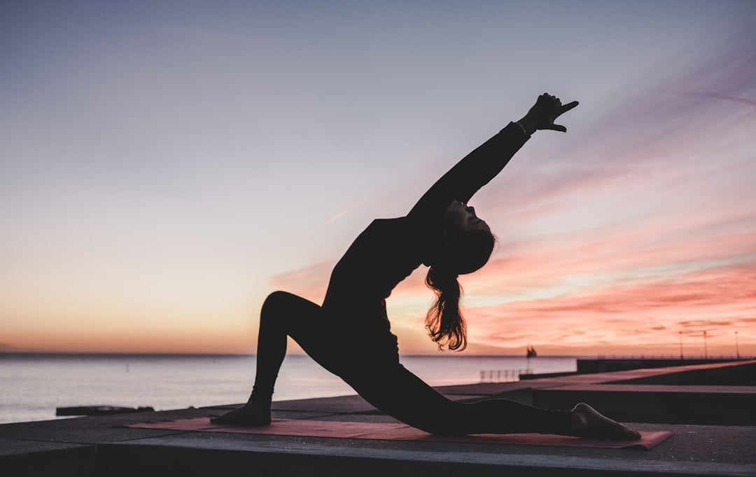 Woman meditating in nature, representing the mind-body connection